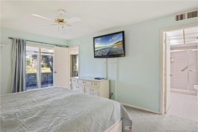 Enjoy first floor living with fantastic views from every room on Martin County Golf Course in Florida - for sale on GolfHomes.com, golf home, golf lot