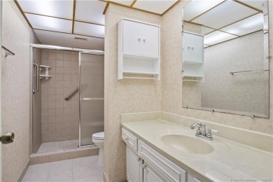 Enjoy first floor living with fantastic views from every room on Martin County Golf Course in Florida - for sale on GolfHomes.com, golf home, golf lot