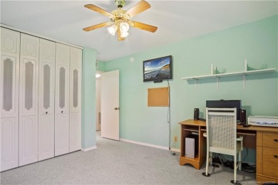 Enjoy first floor living with fantastic views from every room on Martin County Golf Course in Florida - for sale on GolfHomes.com, golf home, golf lot