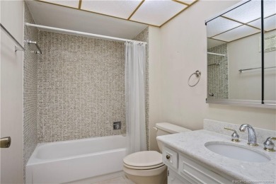 Enjoy first floor living with fantastic views from every room on Martin County Golf Course in Florida - for sale on GolfHomes.com, golf home, golf lot