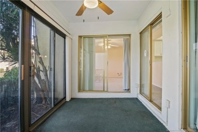 Enjoy first floor living with fantastic views from every room on Martin County Golf Course in Florida - for sale on GolfHomes.com, golf home, golf lot