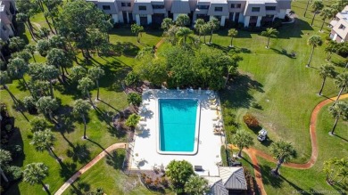 Enjoy first floor living with fantastic views from every room on Martin County Golf Course in Florida - for sale on GolfHomes.com, golf home, golf lot