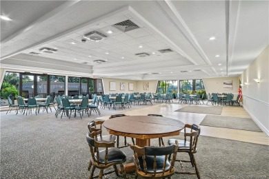 Enjoy first floor living with fantastic views from every room on Martin County Golf Course in Florida - for sale on GolfHomes.com, golf home, golf lot
