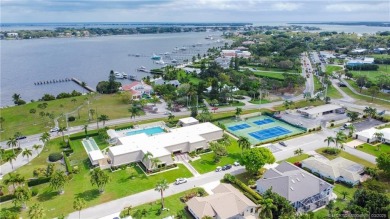 Enjoy first floor living with fantastic views from every room on Martin County Golf Course in Florida - for sale on GolfHomes.com, golf home, golf lot