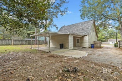 INVESTOR SPECIAL! This delightful Creole-style residence offers on Lake Forest Yacht and Country Club in Alabama - for sale on GolfHomes.com, golf home, golf lot