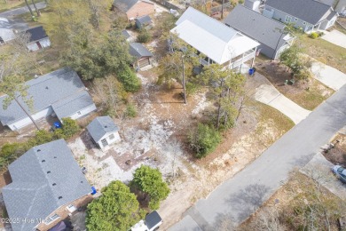 Waterway Views can be yours from this building lot right behind on Founders Club At St. James Plantation in North Carolina - for sale on GolfHomes.com, golf home, golf lot