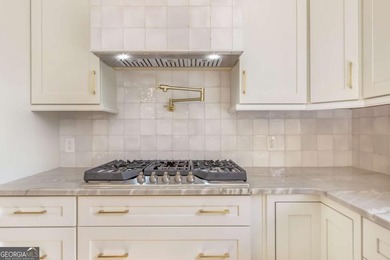 Welcome to this beautifully updated 5-bedroom, 3.5-bath home in on Towne Lake Hills Golf Club in Georgia - for sale on GolfHomes.com, golf home, golf lot