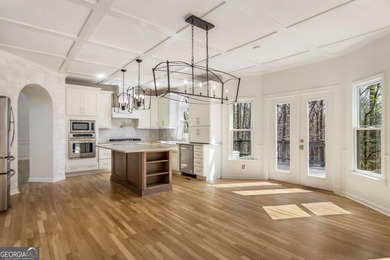 Welcome to this beautifully updated 5-bedroom, 3.5-bath home in on Towne Lake Hills Golf Club in Georgia - for sale on GolfHomes.com, golf home, golf lot