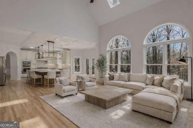 Welcome to this beautifully updated 5-bedroom, 3.5-bath home in on Towne Lake Hills Golf Club in Georgia - for sale on GolfHomes.com, golf home, golf lot