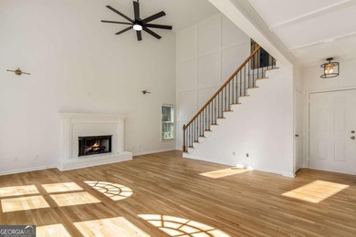 Welcome to this beautifully updated 5-bedroom, 3.5-bath home in on Towne Lake Hills Golf Club in Georgia - for sale on GolfHomes.com, golf home, golf lot