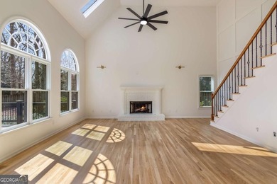 Welcome to this beautifully updated 5-bedroom, 3.5-bath home in on Towne Lake Hills Golf Club in Georgia - for sale on GolfHomes.com, golf home, golf lot