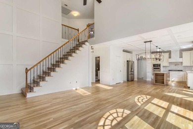 Welcome to this beautifully updated 5-bedroom, 3.5-bath home in on Towne Lake Hills Golf Club in Georgia - for sale on GolfHomes.com, golf home, golf lot