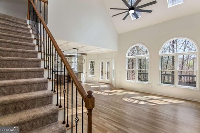 Welcome to this beautifully updated 5-bedroom, 3.5-bath home in on Towne Lake Hills Golf Club in Georgia - for sale on GolfHomes.com, golf home, golf lot