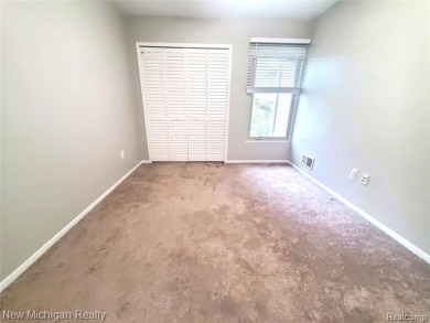 Move-in ready beautifully updated end-unit brick condo in the on Great Oaks Country Club in Michigan - for sale on GolfHomes.com, golf home, golf lot
