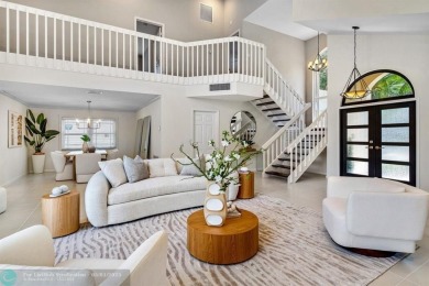 Serene lake views, sunlit living spaces, and a private backyard on Delaire Golf and Country Club in Florida - for sale on GolfHomes.com, golf home, golf lot