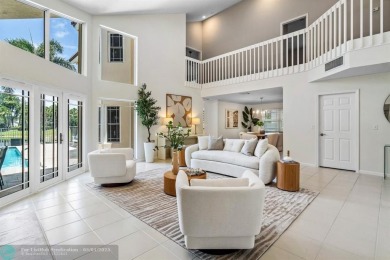 Serene lake views, sunlit living spaces, and a private backyard on Delaire Golf and Country Club in Florida - for sale on GolfHomes.com, golf home, golf lot