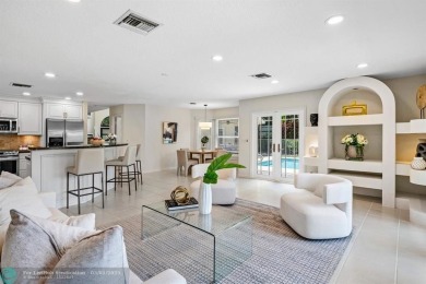 Serene lake views, sunlit living spaces, and a private backyard on Delaire Golf and Country Club in Florida - for sale on GolfHomes.com, golf home, golf lot