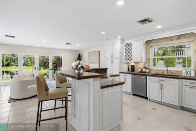Serene lake views, sunlit living spaces, and a private backyard on Delaire Golf and Country Club in Florida - for sale on GolfHomes.com, golf home, golf lot