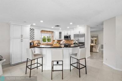Serene lake views, sunlit living spaces, and a private backyard on Delaire Golf and Country Club in Florida - for sale on GolfHomes.com, golf home, golf lot