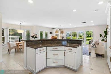 Serene lake views, sunlit living spaces, and a private backyard on Delaire Golf and Country Club in Florida - for sale on GolfHomes.com, golf home, golf lot