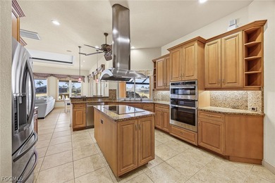 Experience refined living in this beautifully custom home on Royal Tee Country Club in Florida - for sale on GolfHomes.com, golf home, golf lot