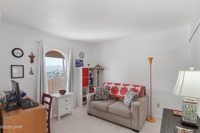 Elevate your lifestyle with sweeping water views and a front-row on London Bridge Golf Course in Arizona - for sale on GolfHomes.com, golf home, golf lot