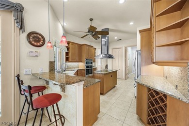 Experience refined living in this beautifully custom home on Royal Tee Country Club in Florida - for sale on GolfHomes.com, golf home, golf lot