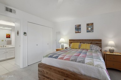 Elevate your lifestyle with sweeping water views and a front-row on London Bridge Golf Course in Arizona - for sale on GolfHomes.com, golf home, golf lot