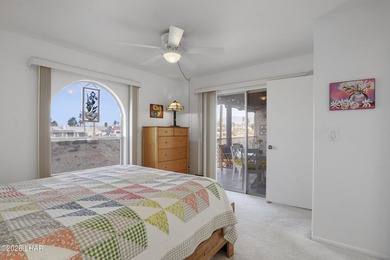 Elevate your lifestyle with sweeping water views and a front-row on London Bridge Golf Course in Arizona - for sale on GolfHomes.com, golf home, golf lot