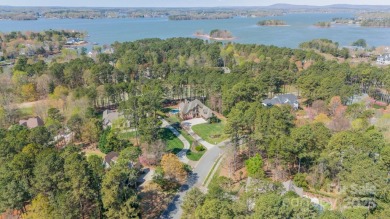 This exquisite custom home, designed by Elite Design Group & on Trump National Golf Club Charlotte in North Carolina - for sale on GolfHomes.com, golf home, golf lot