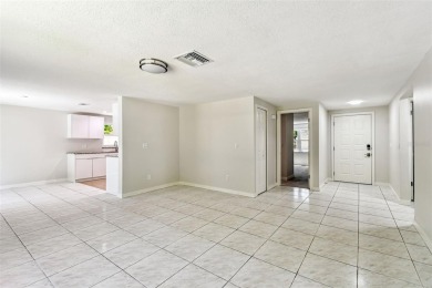 Welcome to this beautifully updated 3-bedroom, 2-bathroom block on Northdale Golf and Tennis Club in Florida - for sale on GolfHomes.com, golf home, golf lot
