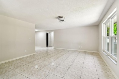 Welcome to this beautifully updated 3-bedroom, 2-bathroom block on Northdale Golf and Tennis Club in Florida - for sale on GolfHomes.com, golf home, golf lot