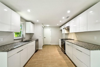 Welcome to this beautifully updated 3-bedroom, 2-bathroom block on Northdale Golf and Tennis Club in Florida - for sale on GolfHomes.com, golf home, golf lot