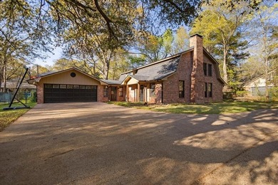 This home delivers immediate curb appeal with a generous front on Hide-A-Way Lake Golf Course in Texas - for sale on GolfHomes.com, golf home, golf lot
