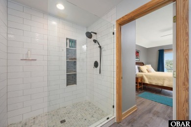 This beautifully updated and versatile coastal retreat offers on Duck Woods Country Club in North Carolina - for sale on GolfHomes.com, golf home, golf lot