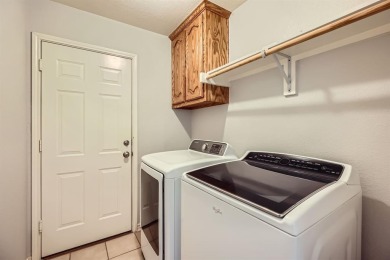 This beautifully maintained 4-bedroom, 2-bathroom home in the on WestRidge Golf Course in Texas - for sale on GolfHomes.com, golf home, golf lot