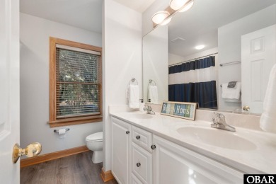 This beautifully updated and versatile coastal retreat offers on Duck Woods Country Club in North Carolina - for sale on GolfHomes.com, golf home, golf lot