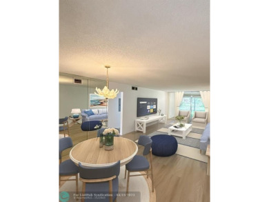 Do not miss this desirable FIRST floor corner unit. This unit is on Wynmoor Golf Course in Florida - for sale on GolfHomes.com, golf home, golf lot