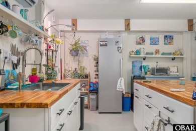 This beautifully updated and versatile coastal retreat offers on Duck Woods Country Club in North Carolina - for sale on GolfHomes.com, golf home, golf lot