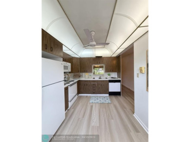 Do not miss this desirable FIRST floor corner unit. This unit is on Wynmoor Golf Course in Florida - for sale on GolfHomes.com, golf home, golf lot