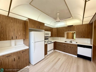 Do not miss this desirable FIRST floor corner unit. This unit is on Wynmoor Golf Course in Florida - for sale on GolfHomes.com, golf home, golf lot