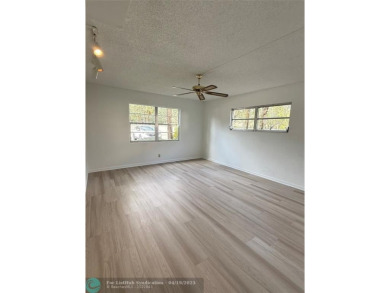 Do not miss this desirable FIRST floor corner unit. This unit is on Wynmoor Golf Course in Florida - for sale on GolfHomes.com, golf home, golf lot