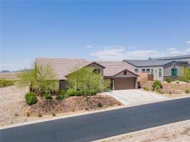 This pristine 2,008 square foot home backs up to the golf course on Laughlin Ranch Golf Club in Arizona - for sale on GolfHomes.com, golf home, golf lot