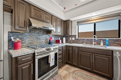 This pristine 2,008 square foot home backs up to the golf course on Laughlin Ranch Golf Club in Arizona - for sale on GolfHomes.com, golf home, golf lot