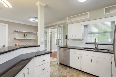 Meticulously maintained 2 bed, 2 bath Dunedin home featuring a on The Dunedin Country Club in Florida - for sale on GolfHomes.com, golf home, golf lot