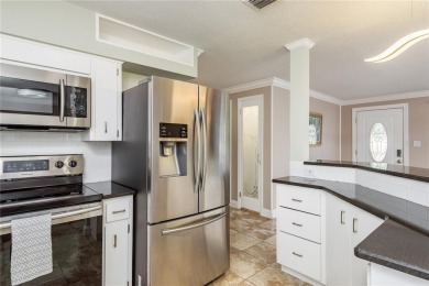 Meticulously maintained 2 bed, 2 bath Dunedin home featuring a on The Dunedin Country Club in Florida - for sale on GolfHomes.com, golf home, golf lot