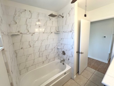 Nicely updated 3/2 brick home perched high for stunning views on Scott Schriener Municipal Golf Course in Texas - for sale on GolfHomes.com, golf home, golf lot