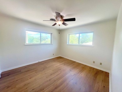 Nicely updated 3/2 brick home perched high for stunning views on Scott Schriener Municipal Golf Course in Texas - for sale on GolfHomes.com, golf home, golf lot
