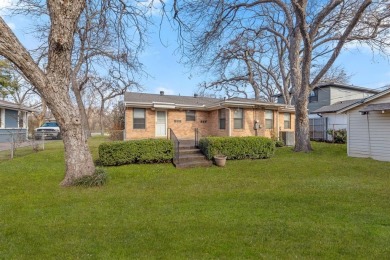 This solid built home sits amongst the huge trees of Kessler on Stevens Park Golf Course in Texas - for sale on GolfHomes.com, golf home, golf lot