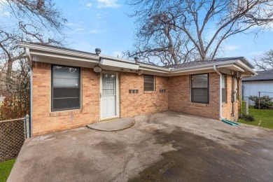 This solid built home sits amongst the huge trees of Kessler on Stevens Park Golf Course in Texas - for sale on GolfHomes.com, golf home, golf lot